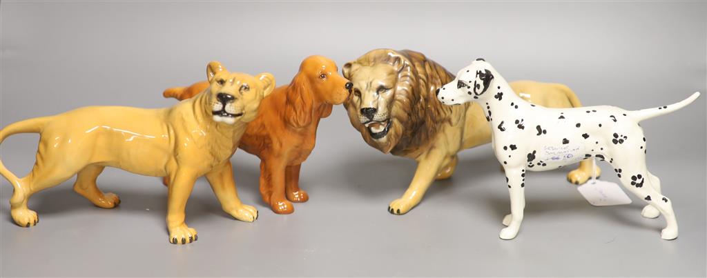 Two Beswick dogs, a lion and a lioness